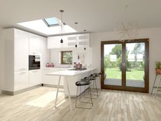 an open kitchen with white cabinets and wood flooring on the walls is pictured in this image