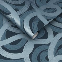 a close up view of a wallpaper with an abstract design in blue and silver