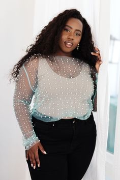 Make waves in the Pearl Diver Layering Top! This mesh long sleeve top is embellished with faux pearls and rhinestones, creating a unique and eye-catching look. Perfect for layering, this on-trend piece will add just the right amount of sparkle and texture to any outfit. Dive deep and stand out! Stretchy Mesh Faux Pearls and Rhinestones Raw Hem Cropped Length 100% Polyester True to Size S: Chest 32" Length 18"M: Chest 34" Length 18"L: Chest 36" Length 19"XL: Chest 38" Length 19"1XL: Chest 40" Len Mesh Pearl Top Outfit, Fitted Mesh Top With Rhinestones For Spring, Fitted Rhinestone Mesh Top For Spring, Pearl Mesh Top Outfit Western, Pearl Cami Top, Pearl Diver, Mesh Long Sleeve Top, Light Cyan, Make Waves