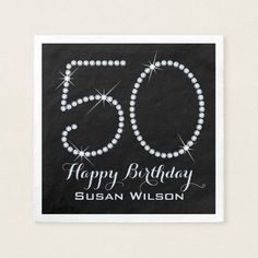 a black and white 50th birthday napkin with the number 50 written in sparkling diamonds on it