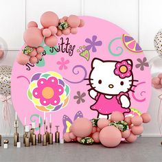 a hello kitty birthday party with balloons and confetti