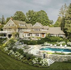 a large house with a pool in the front yard