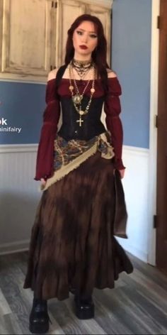 a woman dressed in an old fashion outfit