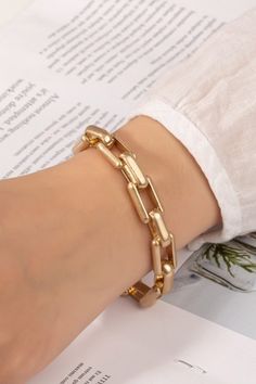 Chunky Chain Gold Bracelet: This worn gold chunky chain bracelet has rectangle and oval links. Solid enough to be worn alone to create a more simplistic look or can be added to a bracelet stack to create a fun chunky look. Length:• 8 inches + 2 inch extender Chunky Bracelet, Chunky Bracelets, A Bracelet, Chain Gold, Bracelet Stack, Gold Plating, Chain Bracelet, Gold Bracelet, Gold Plate