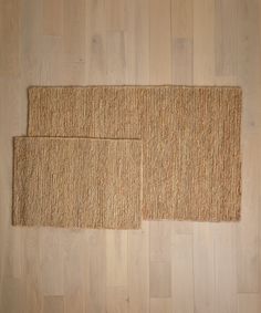 two pieces of jute are laying on the floor