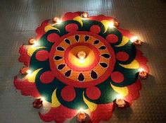 a lit candle is placed in the center of a circular decoration