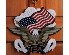 an american flag and eagle on a door with the word usa written in gold letters