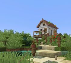 a small house in the middle of a field with flowers on it and stairs leading up to it