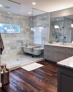 a bathroom with wood floors and marble walls