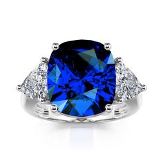 This stunningly beautiful three stone engagement ring would make anyone thrilled to receive it! The deep blue sapphire accented with two gorgeous white stones set in polished sterling silver provides a look that is very modern and classic at the same time! This ring is very fashionable and can add a touch of style to any outfit, yet it is also classy enough to pair easily with formal wear. This ring would be the perfect gift for yourself or your loved one!Carat Weight: 5.6 ctStone Size: 10*12 mm Rings Matching, Artistic Earrings, Rings Antique, Sterling Silver Engagement Rings, Antique Engagement, Three Stone Engagement, Three Stone Engagement Rings, Pretty Rings, Vintage Engagement