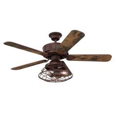 a ceiling fan with two wooden blades and a caged light fixture on the side