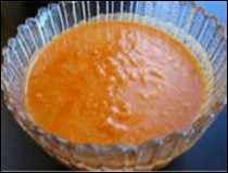 a bowl filled with soup sitting on top of a table