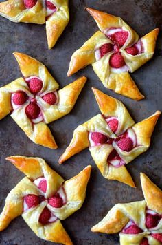 raspberry crescent pastries on a baking sheet