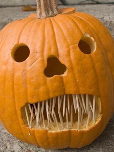 a pumpkin with teeth and spikes on it