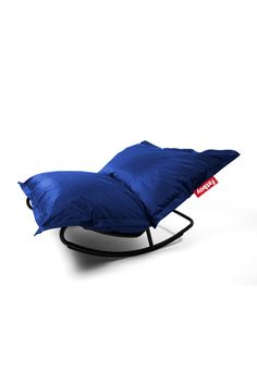 a blue pillow sitting on top of a stand