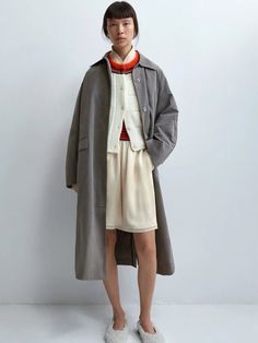 The Cordera Wax Cotton Trench in Taupe Grey is a unique and special rainy trench coat that is light and water repellent. Designed with a relaxed fit and long length, it's a perfect piece for the in-between season. Detailed with covered buttons and two ornamental pockets. 50% cotton / 39% polyester / 16% polyamide Hand wash or dry clean Made in Spain — Cordera, founded by sisters Mónica and María in 2008, has cultivated a distinct identity rooted in minimalism and ethical production practices. Ne Oversized Beige Raincoat For Fall, Oversized Fall Raincoat, Long Single-breasted Fall Raincoat, Fall Long Single-breasted Raincoat, Fall Long Single Breasted Raincoat, Oversized Solid Raincoat For Spring, Oversized Solid Color Raincoat For Fall, Oversized Solid Raincoat For Fall, Oversized Long Raincoat For Fall