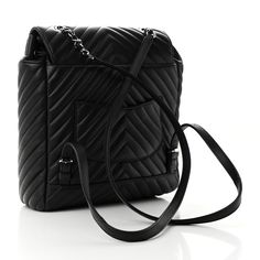 This is an authentic CHANEL Calfskin Chevron Quilted Large Urban Spirit Backpack in Black. This stylish backpack is crafted of soft calfskin leather in a quilted chevron pattern in black. The pack features adjustable leather shoulder straps and a polished silver CC turn-lock closure. The flap has a cinch cord opening that releases to a black fabric interior with zipper and patch pockets. Stylish Backpack, Stylish Backpacks, Chevron Quilt, The Pack, Chevron Pattern, Black Backpack, Black Fabric, Shoulder Straps, Patch Pocket