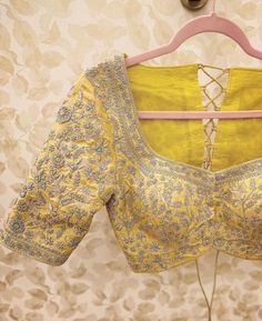 Hand embroidered ready made saree blouse / crop top/stitched saree blouse usa / yellow saree blouse/modern blouse/zardosi blouse/saree blouse/ pure silk blouse/ heavy maggam work blouse / bridal wedding blouse / custom blouse bridal embroidery        It is very true that a perfect blouse is the one which makes your saree look stand out !! If you find one of such a style that you have been wanting to have then dont let it go !! we carry such unique trending blouses that instantly add a stylish look to any saree !!     Well..!! we understand that you may not get in your desired size/pattern, here you go with customization according to your size/pattern which we can deliver in 1-2 weeks of time period !!      Here is a beautiful Hand embroidered heavy zardosi work saree blouse in light yellow Luxury Unstitched Yellow Blouse, Intricate Embroidered Top For Wedding Diwali, Resham Embroidered Top For Wedding And Navratri, Yellow Silk Blouse Piece With Dori Work, Yellow Silk Blouse With Dori Work, Designer Dola Silk Yellow Blouse, Designer Yellow Dola Silk Blouse, Yellow Dola Silk Blouse Piece With Zari Work, Traditional Yellow Dola Silk Blouse