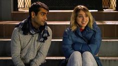 a man and woman sitting on the steps in front of some stairs with their heads turned to one another