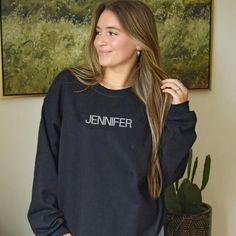 Stay cozy and stylish with this custom embroidered name sweatshirt, perfect for moms on the go. This trendy crewneck is a personalized piece, designed to add a special touch to any wardrobe, making it an ideal gift for moms or anyone who loves a unique touch. Comfortable and fashionable, it’s the perfect addition to your casualwear collection.- Details -- This listing is for 1 custom EMBROIDERED text sweatshirt with your choice of wording.- Please see sizing chart in photos. These are unisex swe Sporty Crew Neck Sweatshirt With Name Print, Custom Name Long Sleeve Cotton Sweatshirt, Personalized Name Print Crew Neck Top, Personalized Name Print Crew Neck T-shirt, Personalized Name Print Long Sleeve Sweatshirt, Trendy Crewneck, Sweatshirt Fabric, Personalized Embroidered, Large White