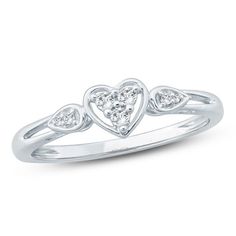 A sweet symbol of your love, this heart promise ring glistens with diamonds. Crafted in cool 10K white gold, this shimmering design features a trio of diamonds within a heart outline. Sparkling diamonds in teardrop-shaped frames flank the centerpiece and decorate the split shank. Radiant with 1/10 ct. t.w. of diamonds and a bright polished shine, this promise ring is a meaningful seal of your affection. White Heart Ring With Diamond Accents For Promise, Wedding Rings Heart, Lesbian Wedding Rings, Rings Pandora, Delicate Gold Ring, Gold Promise Ring, Heart Promise Rings, Pandora Jewelry Charms, Silver Wrap Ring