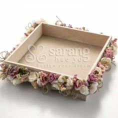 an empty wooden tray with flowers on the bottom and writing that says savy & let's love design your dream