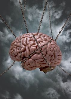 a human brain suspended by chains on a cloudy sky with dark clouds in the background