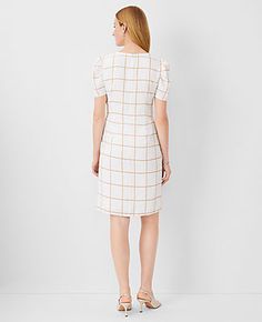 Elevate your wardrobe with the Ann Taylor Plaid Short Sleeve Sheath Dress, a testament to polished, effortless style. This dress features a classic plaid pattern that brings a touch of sophistication to any occasion.

- Size: 14
- Color: Baguette
- Material: 100% Polyester
- Gender: Female
- Neckline: Crew neck
- Sleeve Type: Short sleeves with shirred caps
- Length: 20" from natural waist, hits above the knee
- Closure: Hidden back zipper with hook-and-eye
- Care: Machine washable

Designed for Shirred Sleeve, Getaway Dress, Work Sweaters, Knitted Suit, Plaid Shorts, Midi Maxi Dress, Size 16 Dresses, Effortless Chic, Fit N Flare Dress