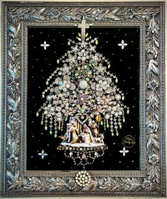 a christmas tree made out of beads and other items in a silver frame on a black background