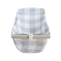 a white and grey checkered baby bassinet with a beige handle on it