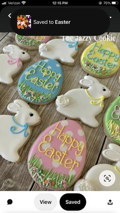 decorated easter cookies on a wooden table with the words happy easter written in large letters