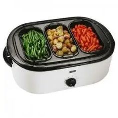 an electric food warmer with four compartments filled with vegetables