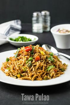 a white plate topped with rice and veggies