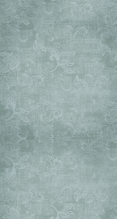 an area rug that is made up of light green and white fabric with swirls on it