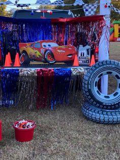 a car themed birthday party with red, white and blue decorations