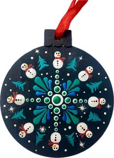 a christmas ornament with snowmen on it