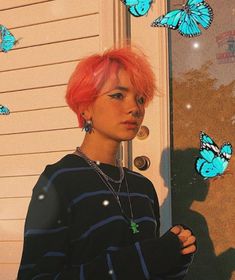 a woman with pink hair standing in front of a door and butterflies flying around her