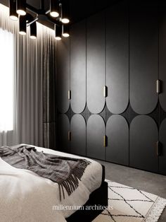 a black and white bedroom with modern lighting fixtures on the headboard, closets in the background