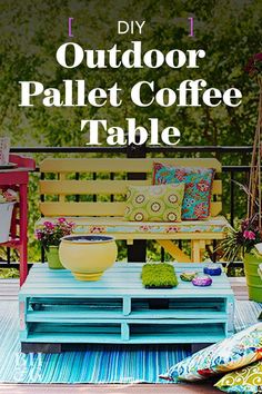 an outdoor pallet coffee table with colorful cushions