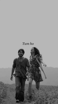 two people walking down a dirt road with the words turn ho on top of them