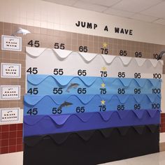 a classroom wall with numbers and dolphins on it