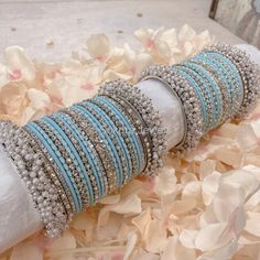 Large stack of Silver, Pearl and light blue detail bangles finished with our Thanjina Cluster pearl end bangles. Ready to Ship! Bridal Survival Kit, Blue Bangles, Bangle Stack, Bangle Box, Hand Harness, Indian Blue, Dresses For Summer, Gold Bangle Set, Bridal Choker