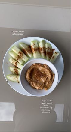 an overhead view of apples with peanut butter on the side and cinnamon dip in a bowl