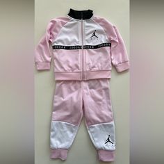 Washed But Never Worn Product #: 5a838a9y Supplier-Sku #: 65a838-A9y Light Yet Warm, The Jordan Jumpman Air Blocked Tricot Set Keeps Your Baby Boys Bundled Up In Fuss-Free Comfort. Featuring Throwback Sportswear Details Like A Stand Collar, Logo Trim, Long Sleeves, And Snug Cuffs, This Tracksuit Set Is A Retro-Cool Addition To Your Little Ones’ Rotation. The Pants Feature A Stretchy Elastic Waistband That Offers A Snug Fit And Taper Towards The Snug Ankle Cuffs, Showing Off Baby Sneakers. Comple Sporty Pink Long Sleeve Sets, Sporty Color Block White Sets, Casual Pink Sports Sets, Sporty Pink Streetwear Sets, Sporty Pink Sets For Spring, Sporty Pink Spring Sets, Casual Pink Color Block Sets