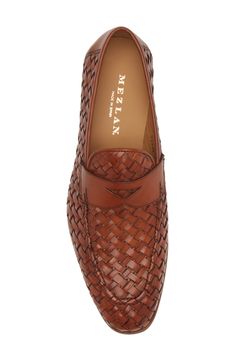 A woven upper and geometric penny keeper add modern elements to a sophisticated leather loafer featuring a slender moc toe. Cushioned footbed Leather upper, lining and sole Made in Spain Luxury Woven Leather Slip-on Loafers, Elegant Slip-on Moccasins With Woven Sole, Formal Loafers With Woven Sole And Round Toe, Elegant Brown Woven Leather Loafers, Elegant Woven Leather Slip-on Loafers, Elegant Woven Leather Loafers, Classic Woven Leather Loafers With Round Toe, Elegant Loafers With Woven Sole For Workwear, Classic Slip-on Woven Leather Loafers