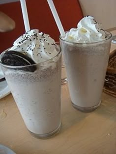 two drinks with whipped cream and oreo cookies