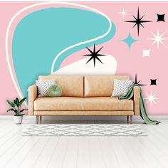 a living room with a couch and stars on the wall behind it in front of a pink background