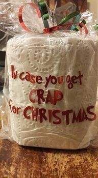 a toilet paper roll wrapped in plastic with the words crap for christmas written on it