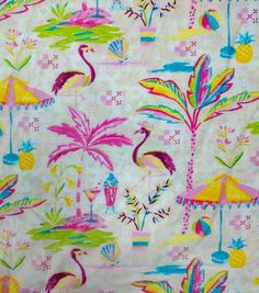 the fabric is very colorful and has flamingos, pineapples, and umbrellas on it