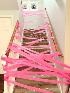 pink streamers are on the stairs to go up in the house, and it's not too long enough for you to walk down